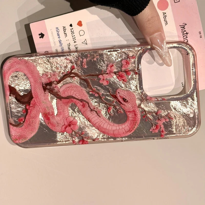 Elegant plum blossom and pink snake illustration phone case for iPhone. Combines artistic design with reliable protection against scratches and everyday wear.