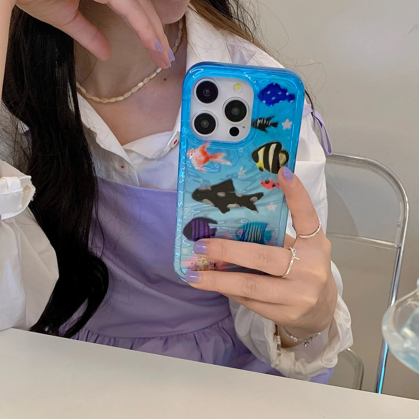 Korean-inspired ripple texture phone case featuring adorable aquatic fish design. Stylish and protective, it safeguards your iPhone from scratches while adding a cute, playful look.