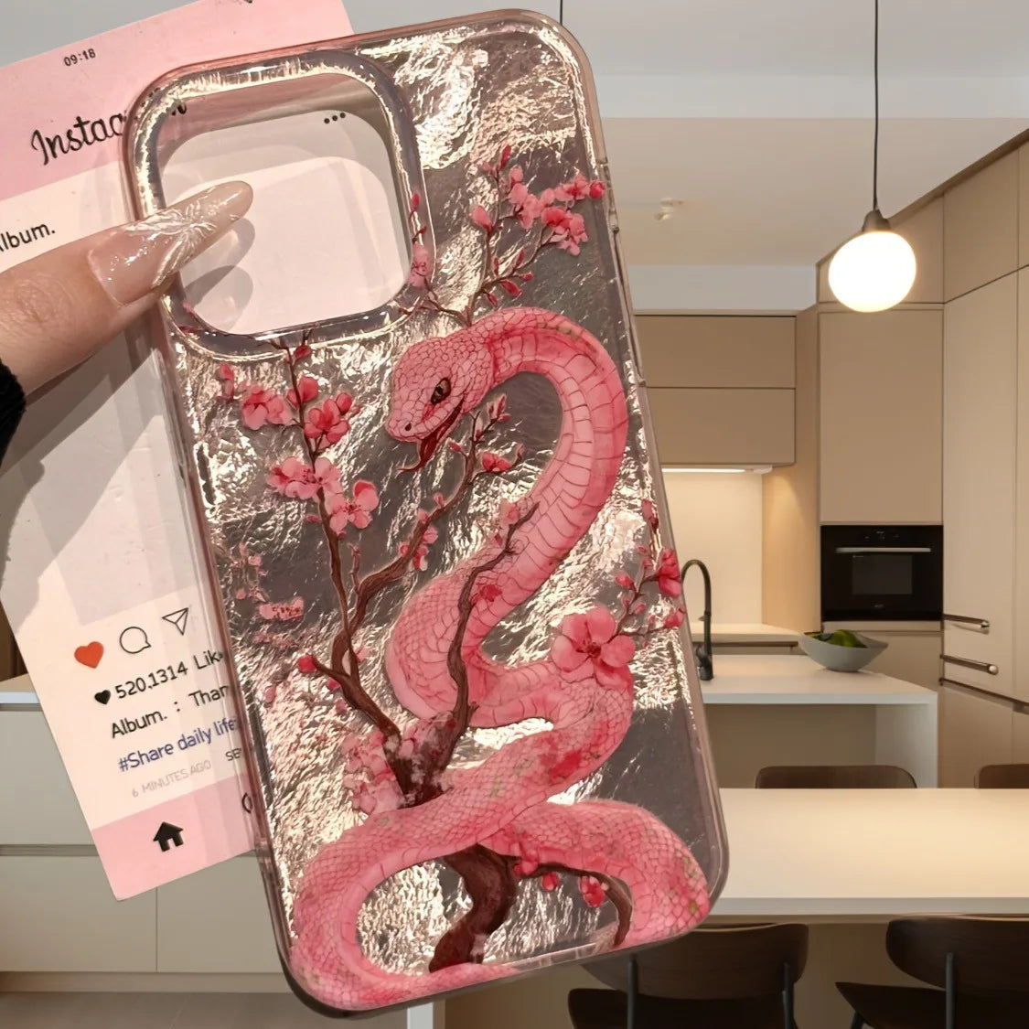 Elegant plum blossom and pink snake illustration phone case for iPhone. Combines artistic design with reliable protection against scratches and everyday wear.