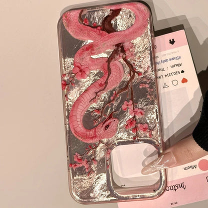 Elegant plum blossom and pink snake illustration phone case for iPhone. Combines artistic design with reliable protection against scratches and everyday wear.